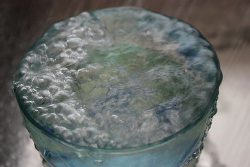A glass of running water - closeup