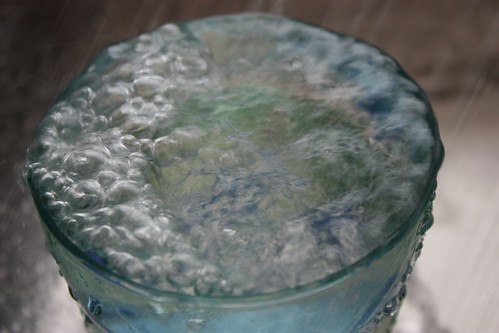 A glass of running water - closeup